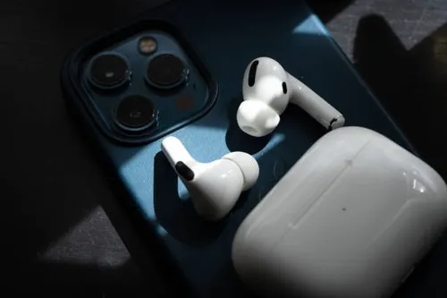 Apple AirPods Pro earbuds inside charging case during firmware update